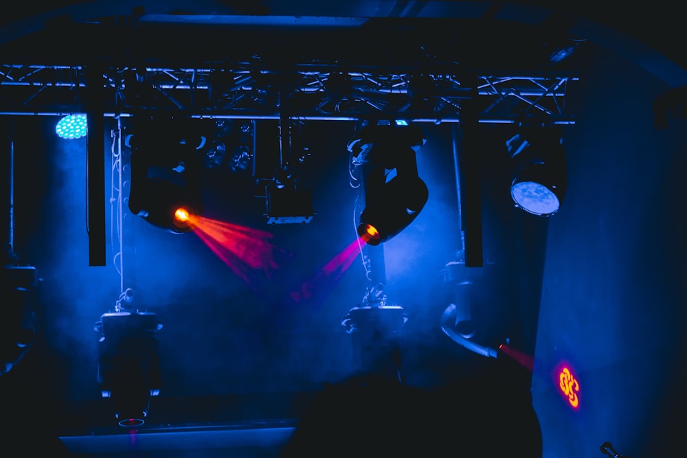 man in black shirt standing on stage