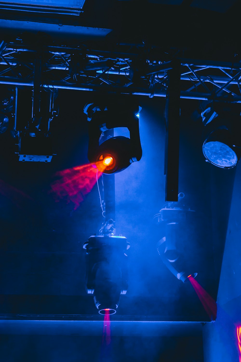 man in black shirt standing on stage