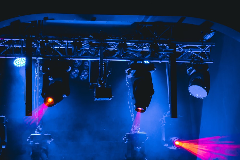 man in black jacket standing on stage