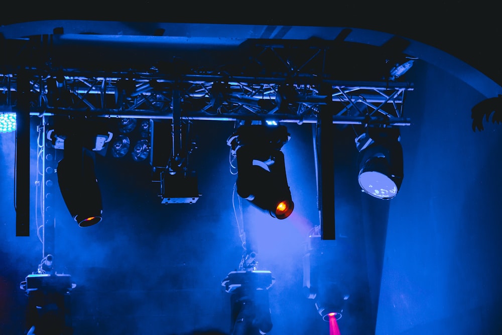 man in black jacket standing on stage