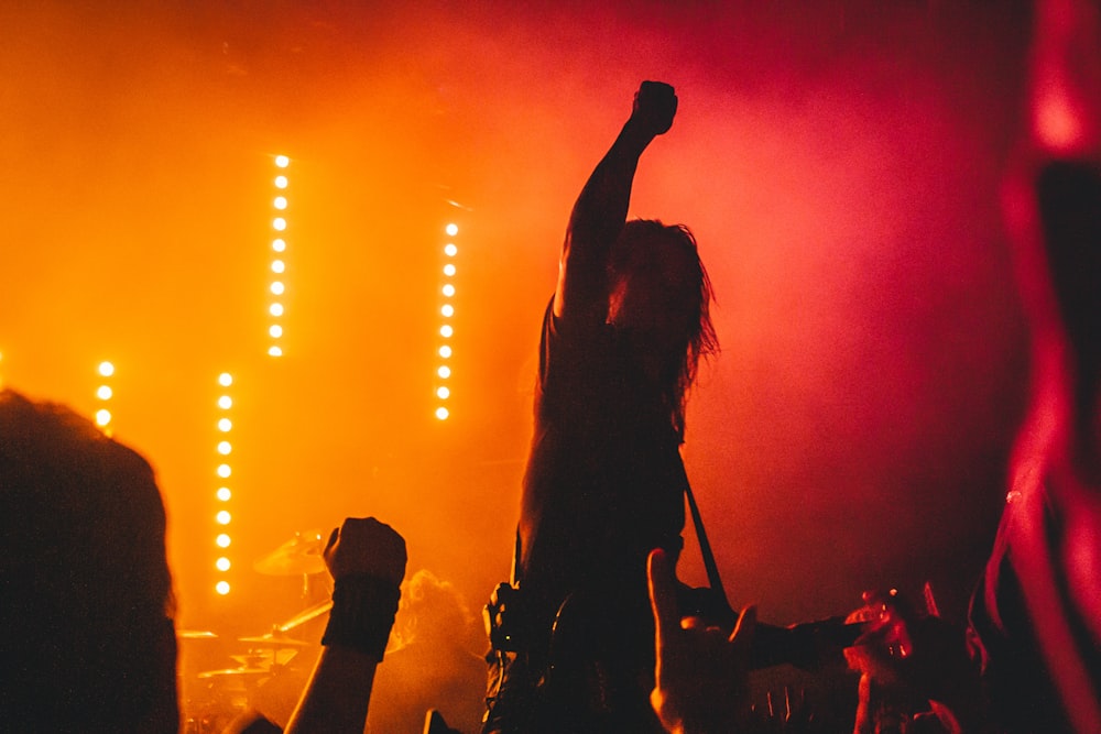 silhouette of woman singing on stage