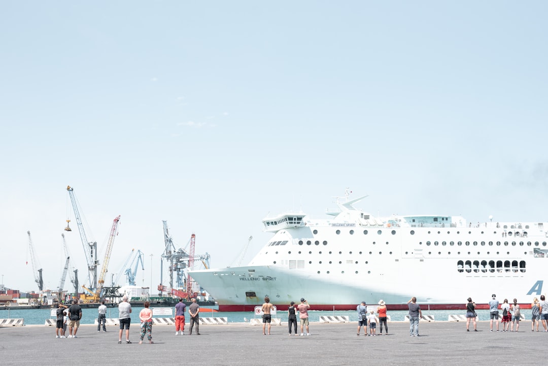 people walking on white ship during daytime