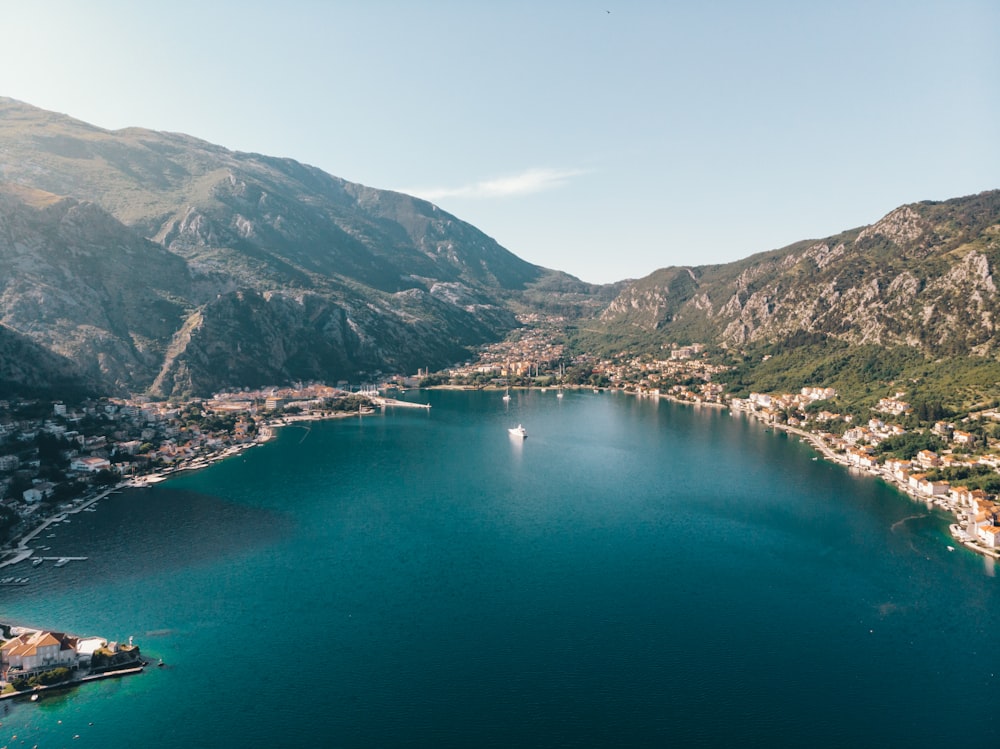 aerial view of lake between mountains during daytime