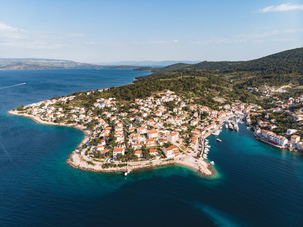 aerial view of city near body of water during daytime