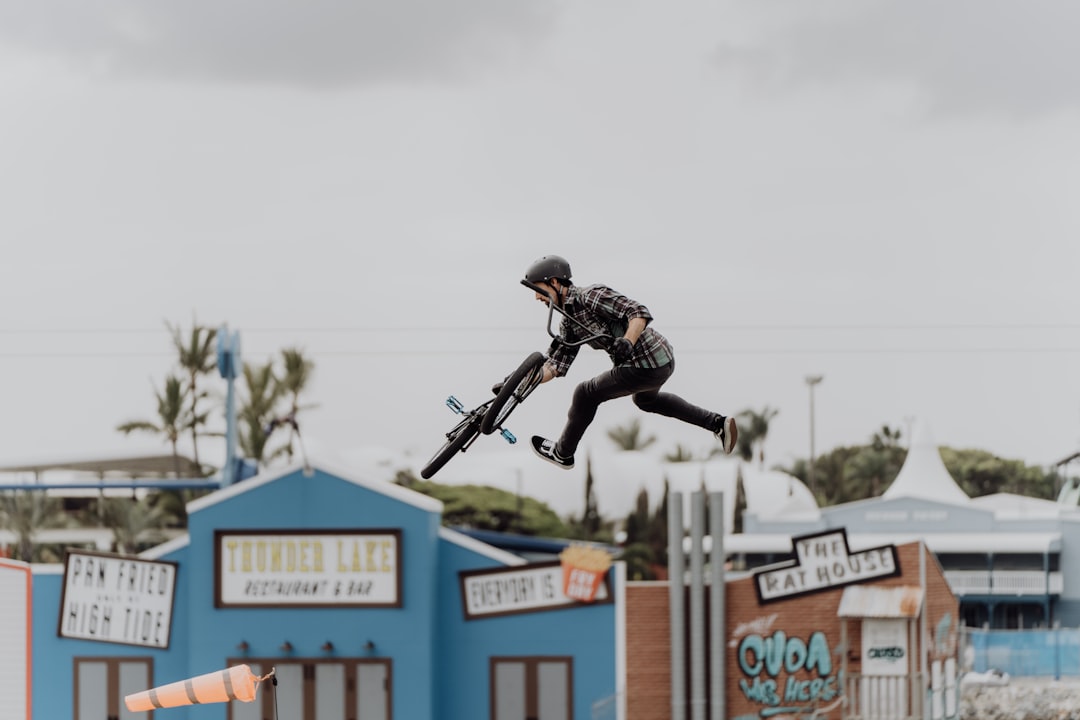 man in black jacket and pants riding on black motorcycle during daytime