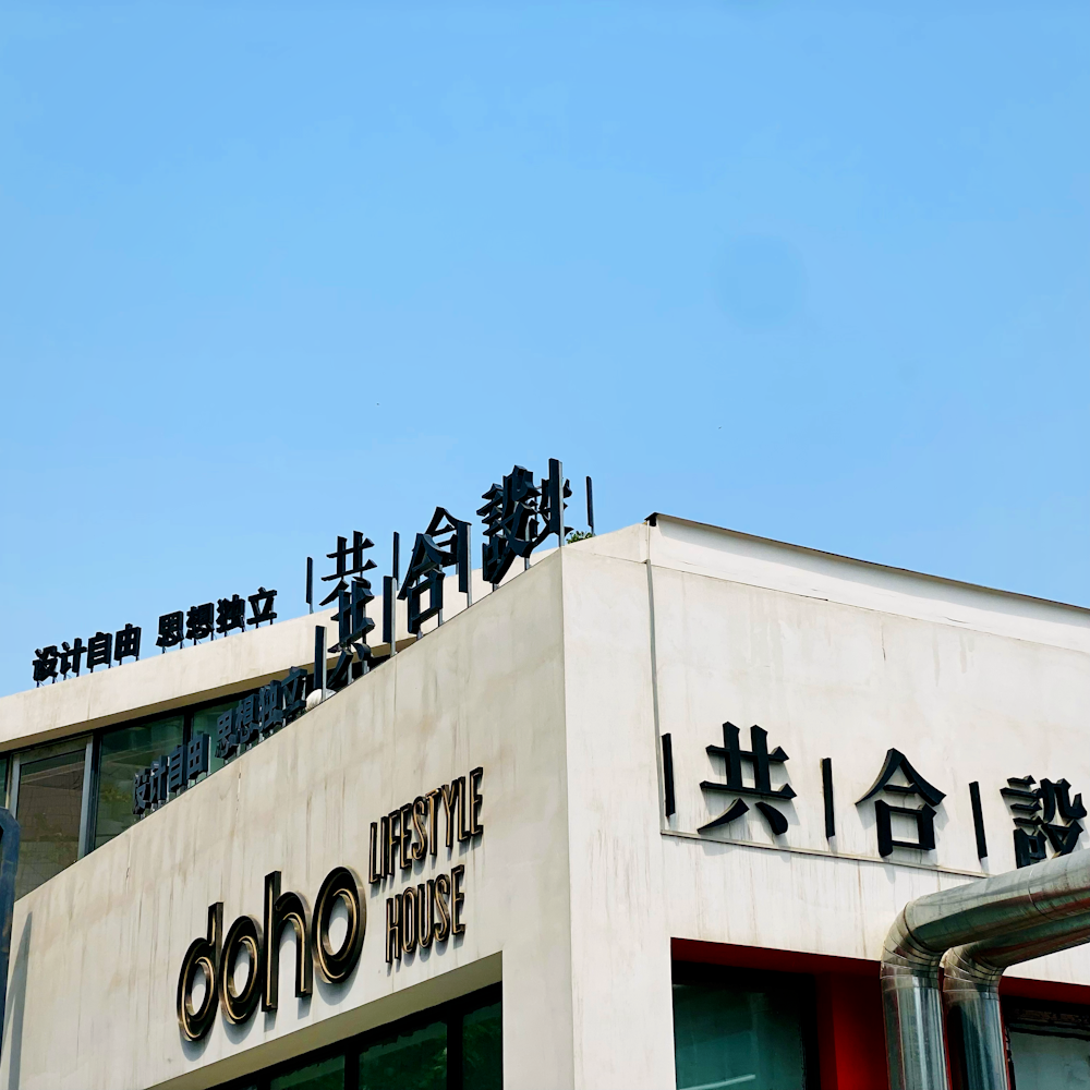 white and black concrete building under blue sky during daytime