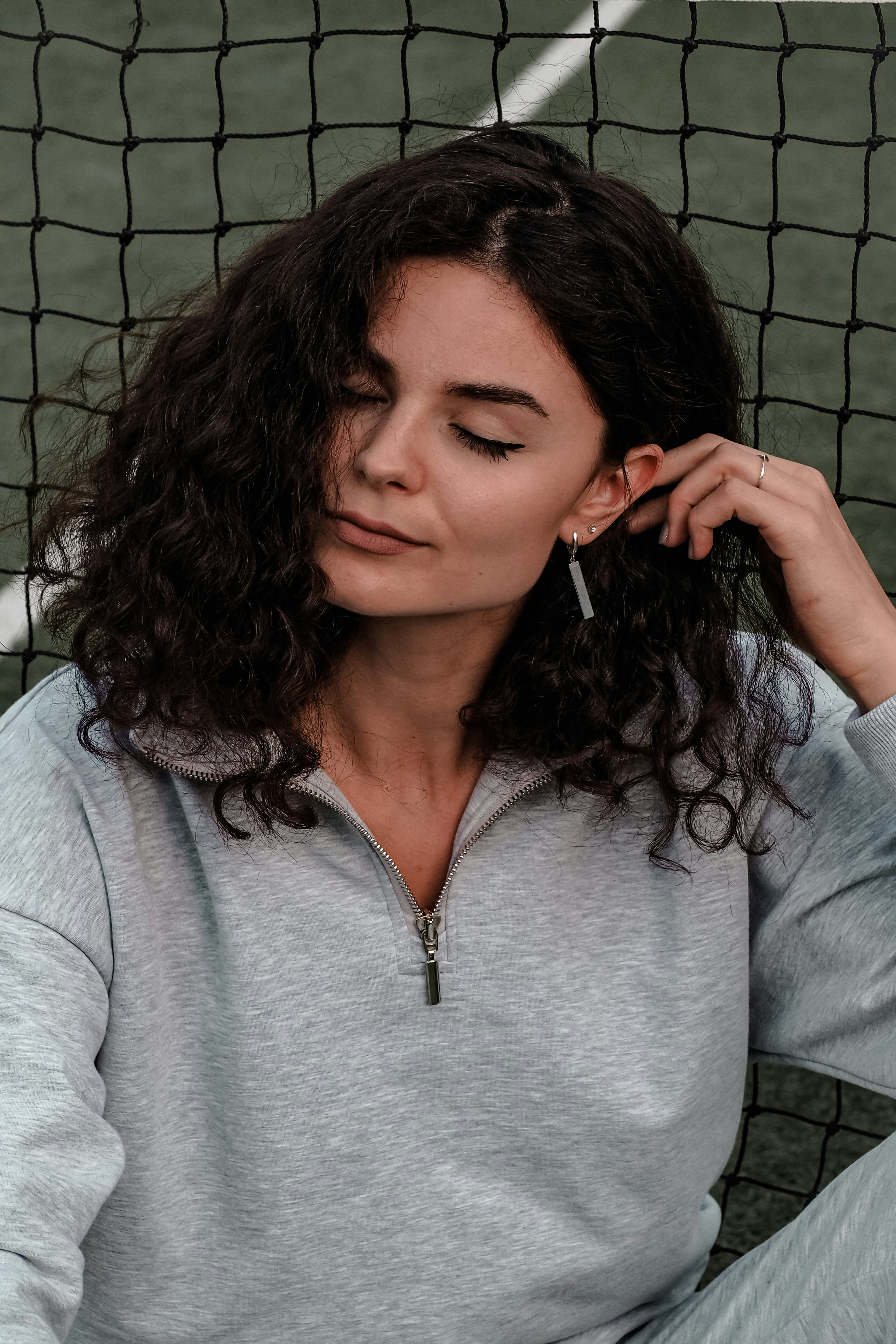 woman in gray v neck long sleeve shirt