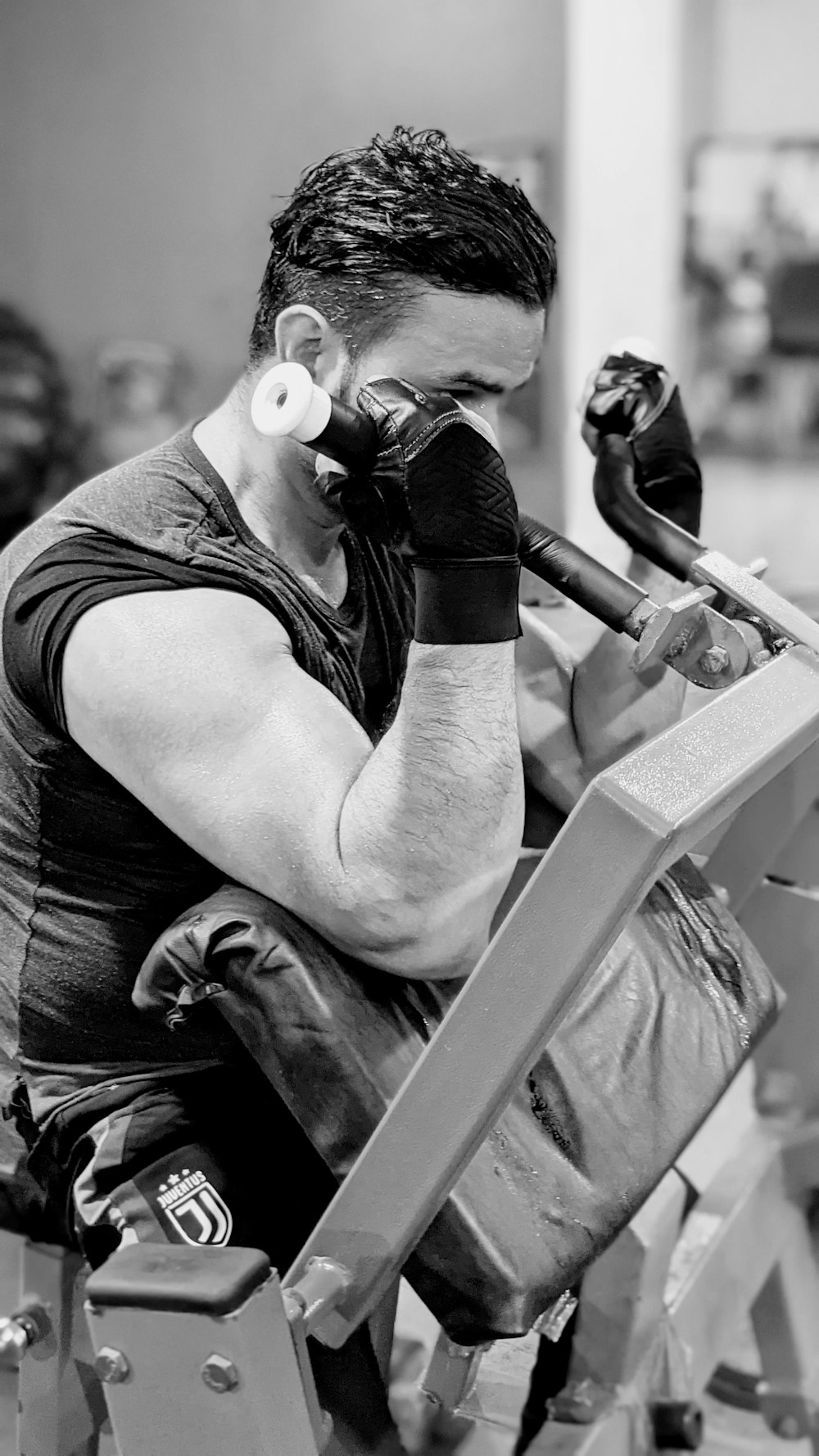 man in black tank top using dslr camera