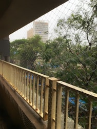 A wide view of a Chennai terrace fully secured with safety nets, overlooking the city skyline.