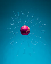 A glowing gold cricket ball flying out of a digital wallet on a dark stadium background.