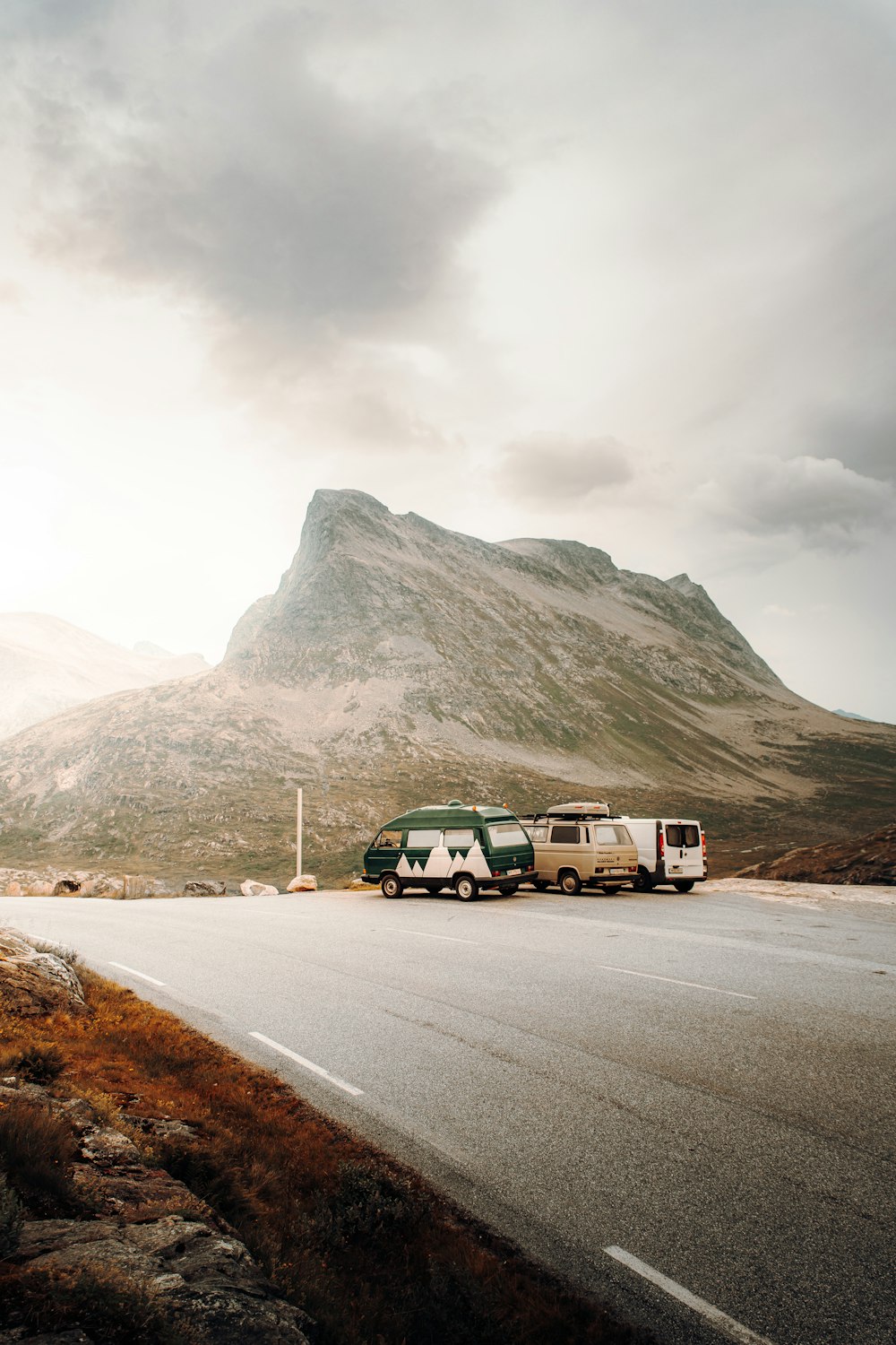 white van on road near mountain during daytime