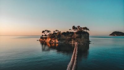 brown wooden dock on body of water during daytime