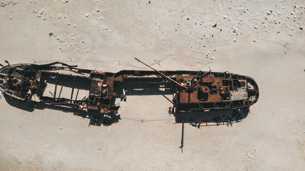 brown and black helicopter on white sand