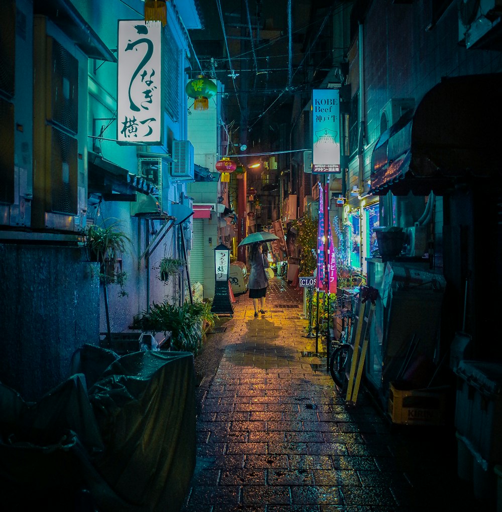 people walking on street during nighttime