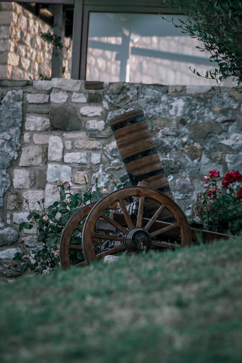 brown wooden wheel on green grass field