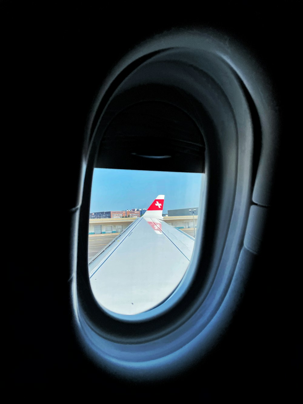 airplane window with airplane wing