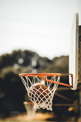 Crisp shot of a basketball swishing through the net