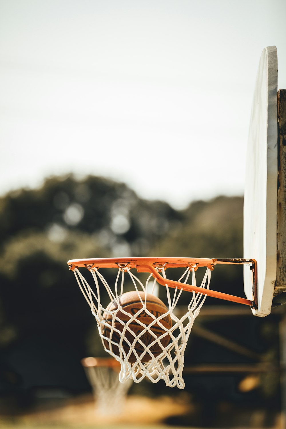 white and orange basketball hoop