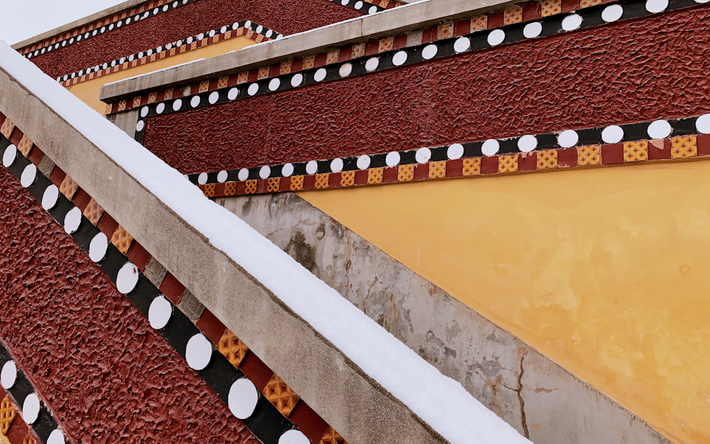 yellow and brown concrete staircase