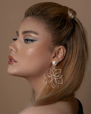 woman with silver flower earring