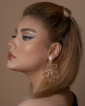 woman with silver flower earring