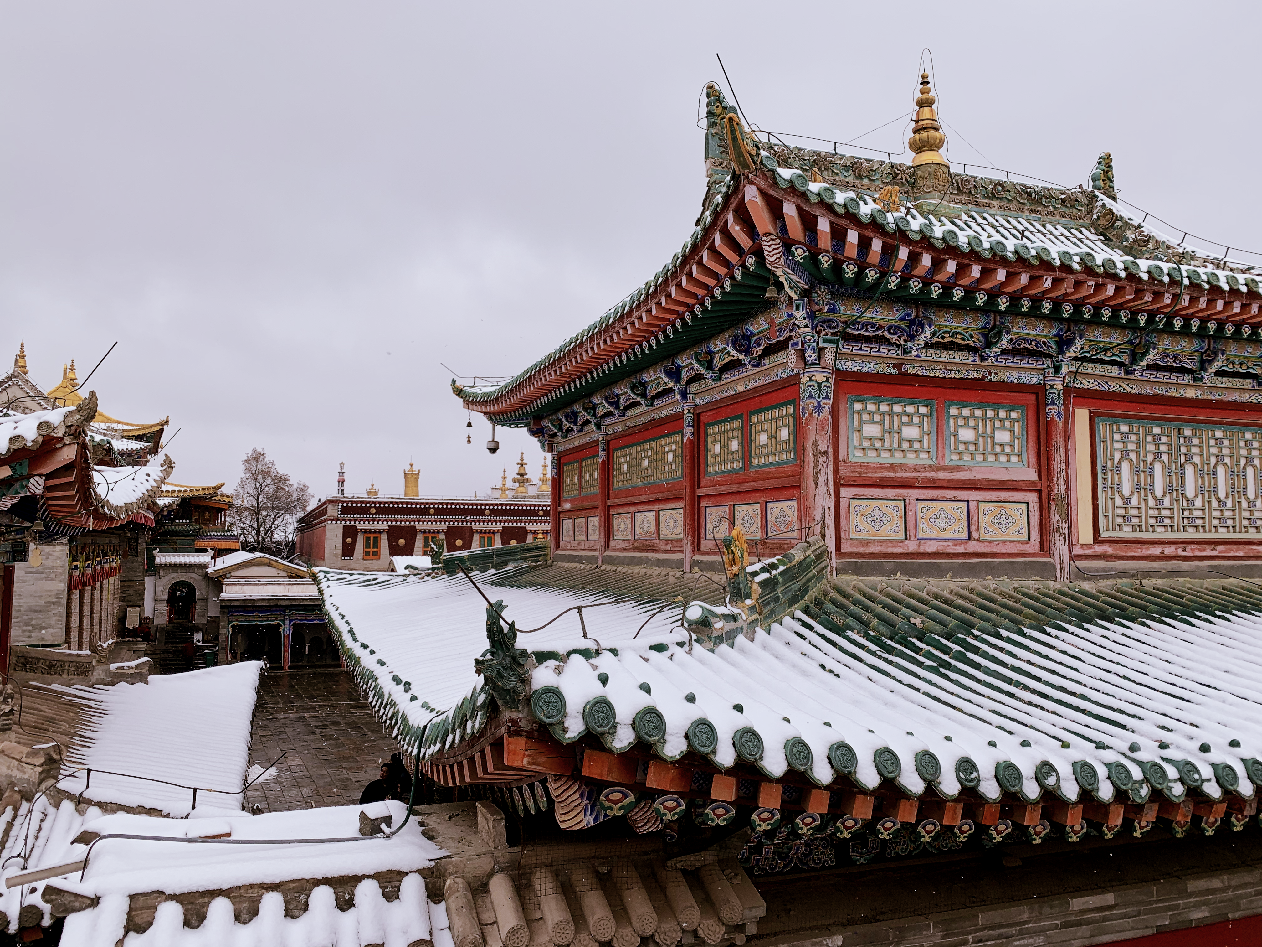 red and white temple under white sky during daytime