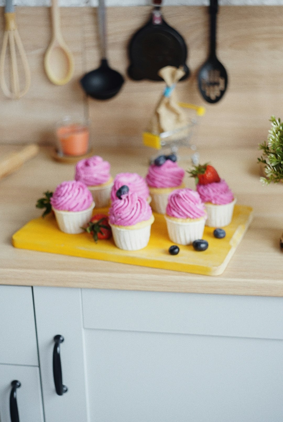 cupcakes on brown wooden tray