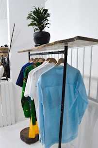 blue textile on brown wooden rack