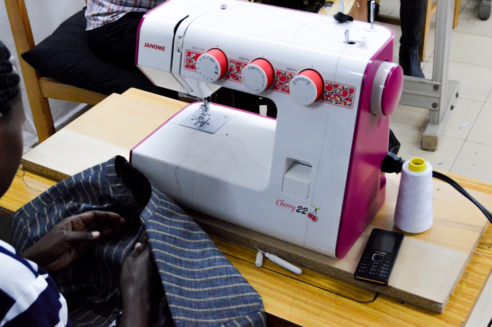 white and red sewing machine