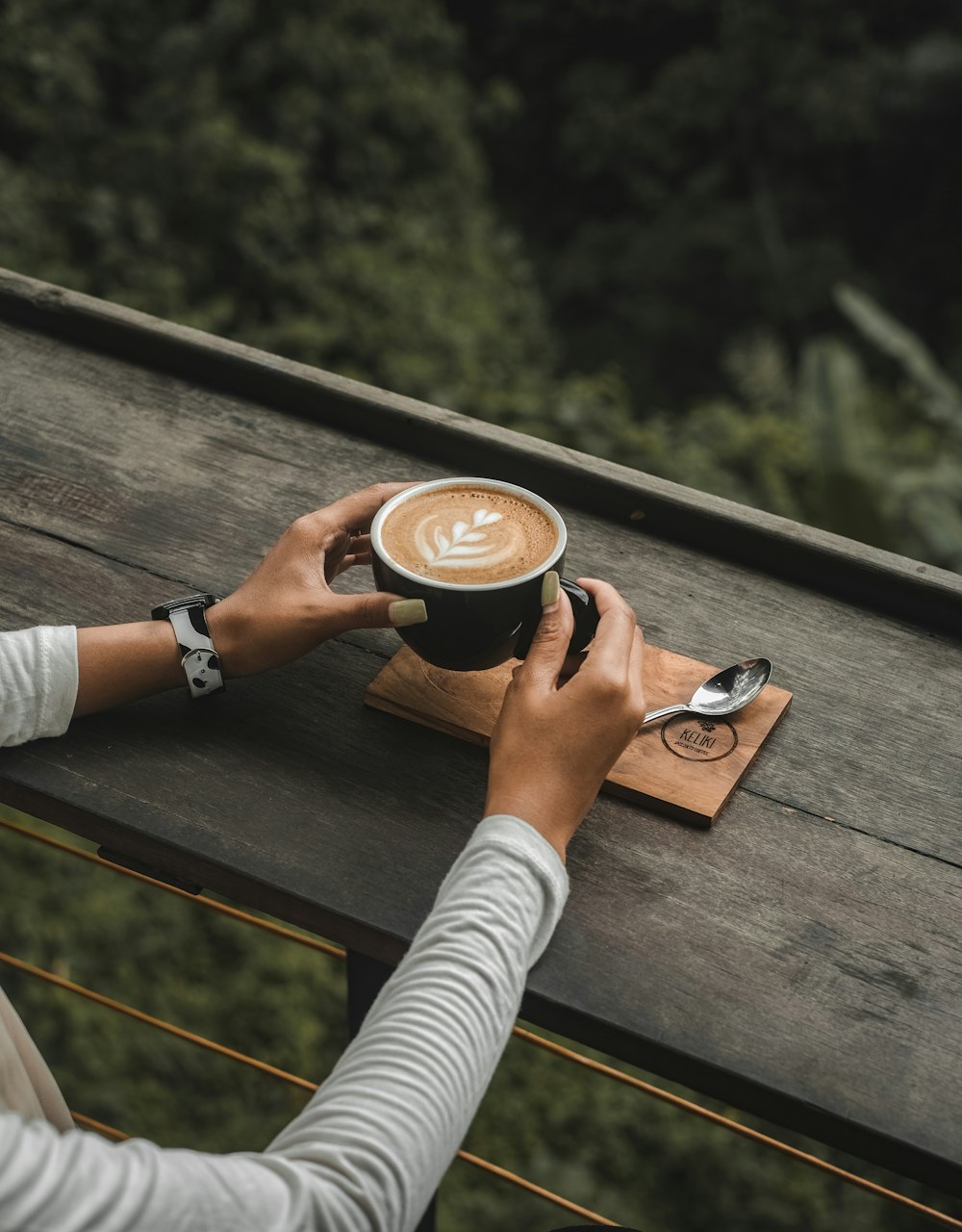 person holding cup of coffee