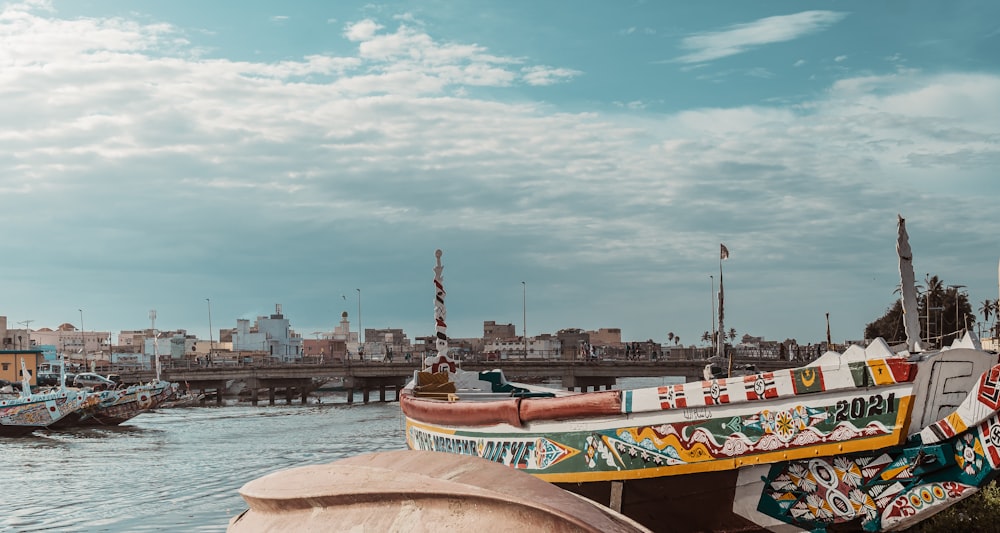 brown and white boat on water during daytime