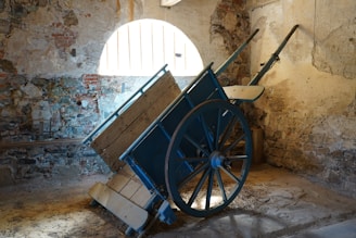 Close-up of sturdy black iron frame and smooth wooden surface of the wine cart in a modern living room.