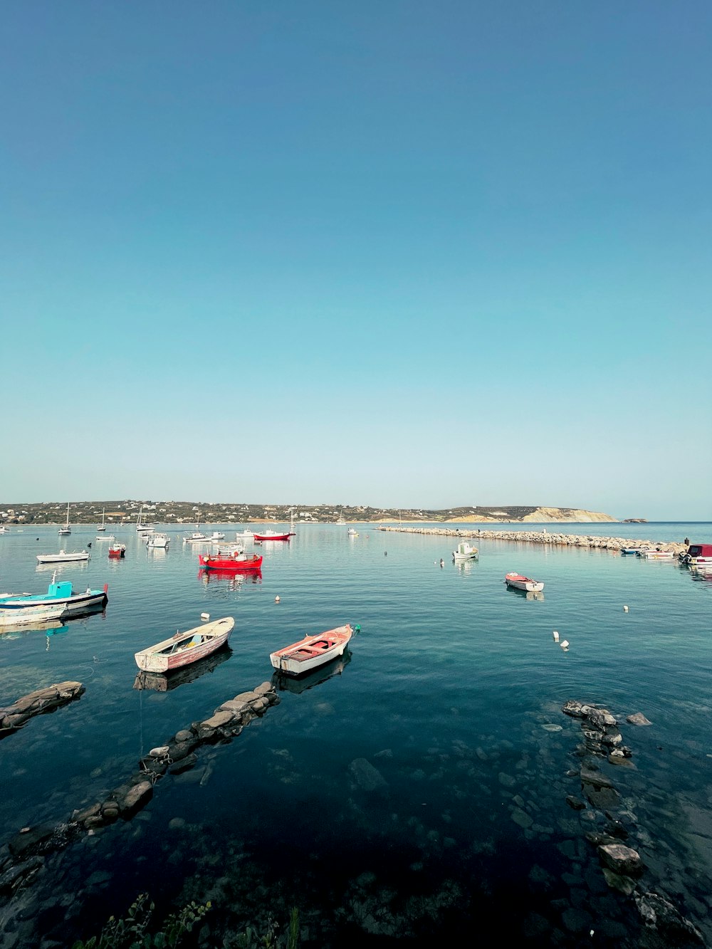 white and red boat on sea during daytime