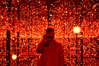 Close-up of a guest posing inside the 360 video booth with vibrant lighting effects.