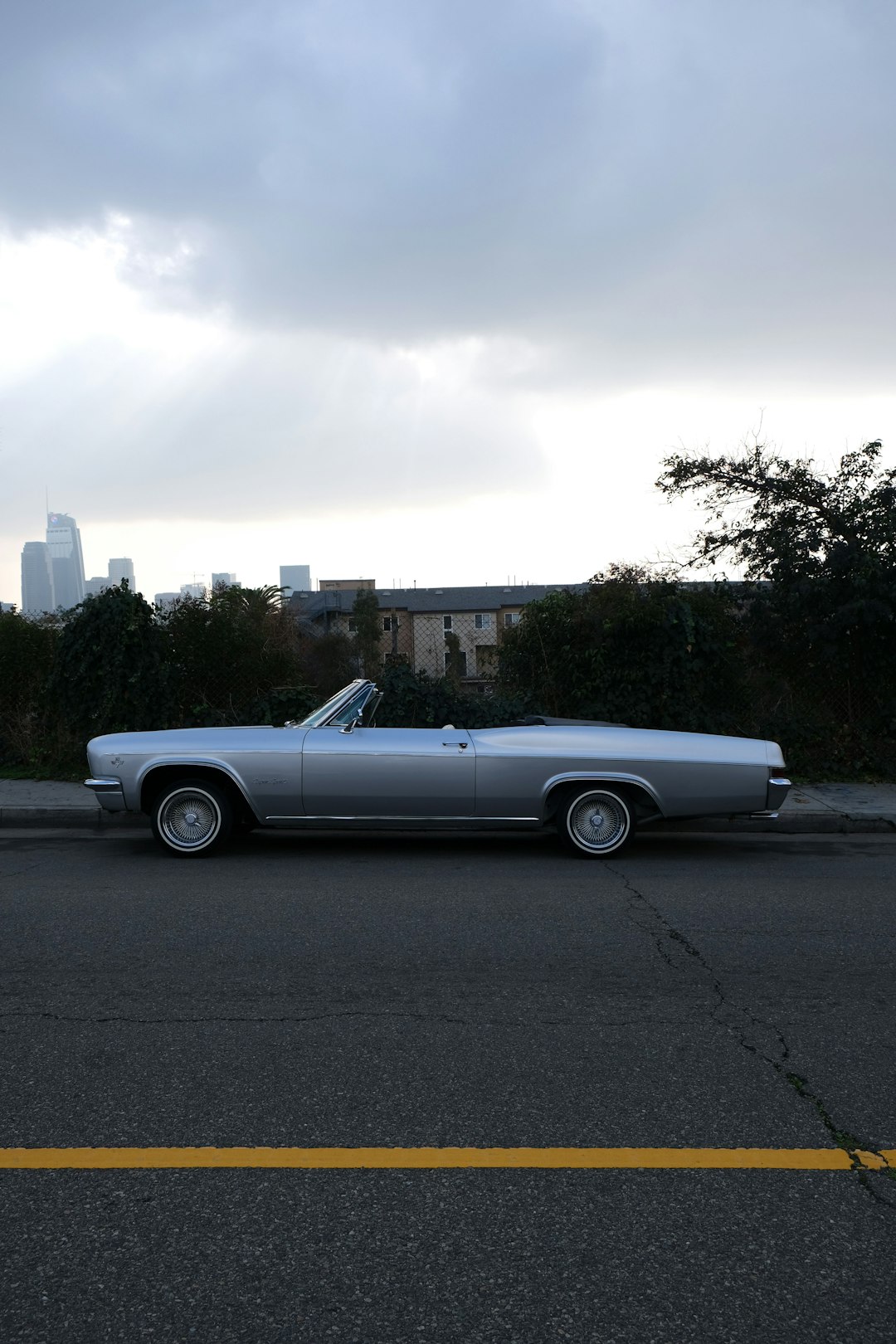 white coupe on road during daytime