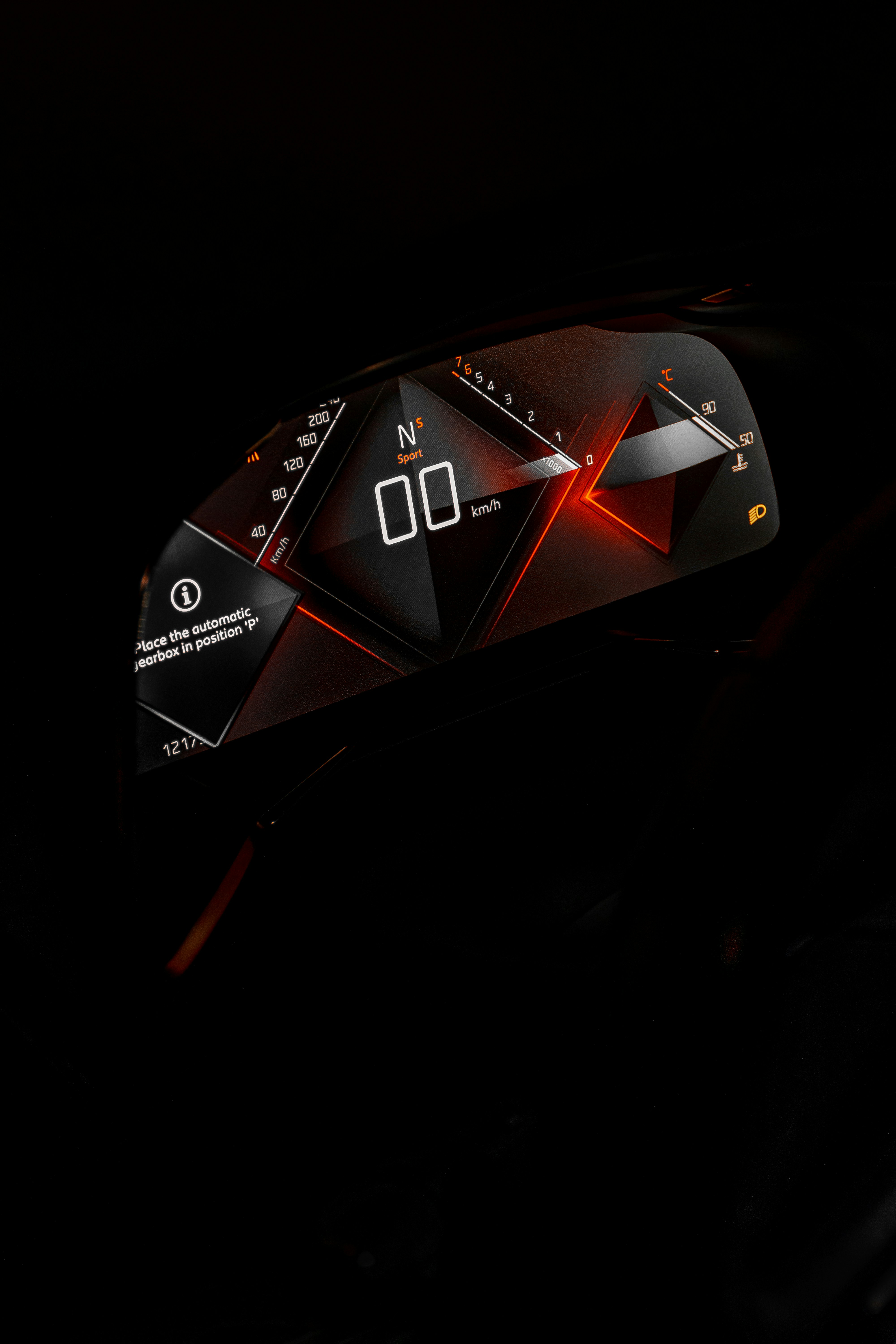 a close up of a speedometer in the dark