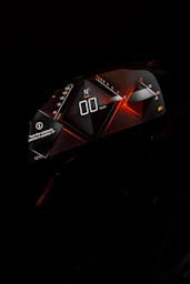 a close up of a speedometer in the dark