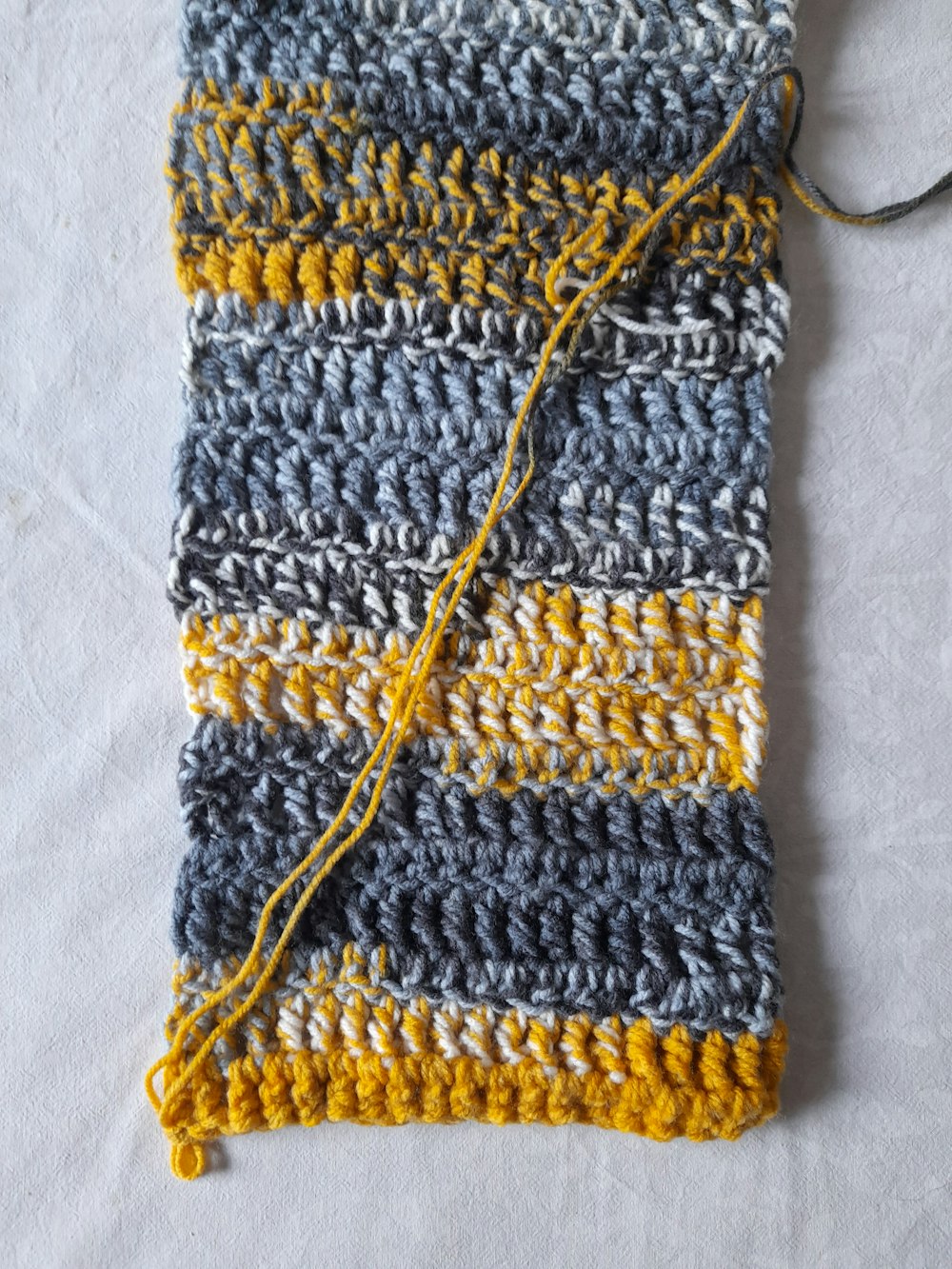 yellow and black knit textile