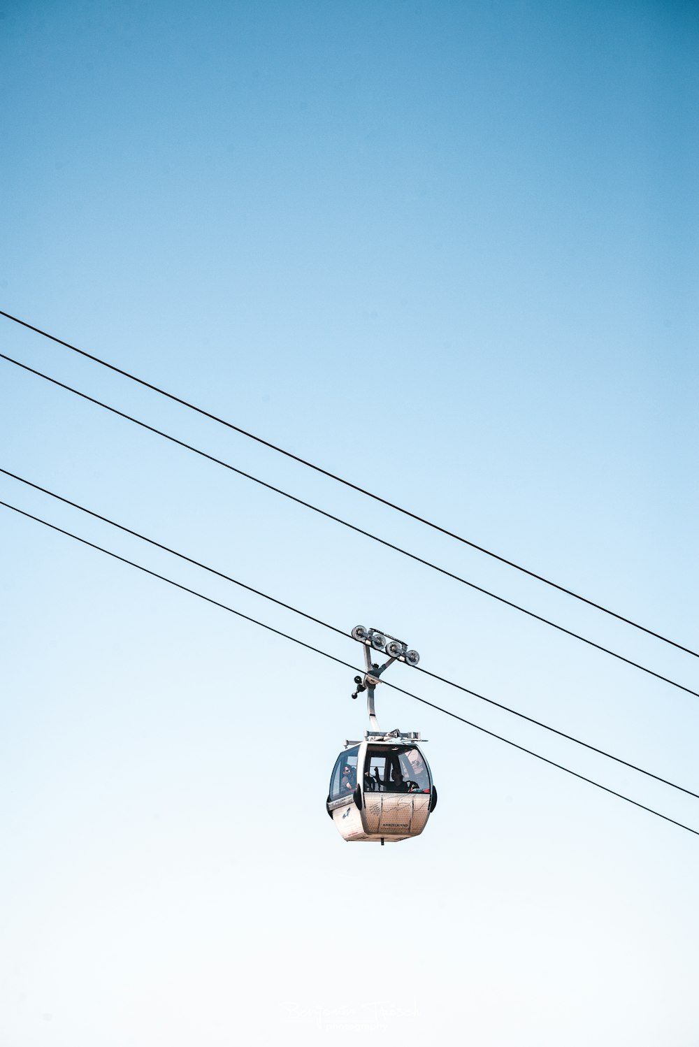 brown cable car under blue sky during daytime