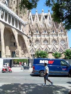 Sheffield Swift Moves van parked near the historic Sheffield Cathedral with team members preparing for a move.