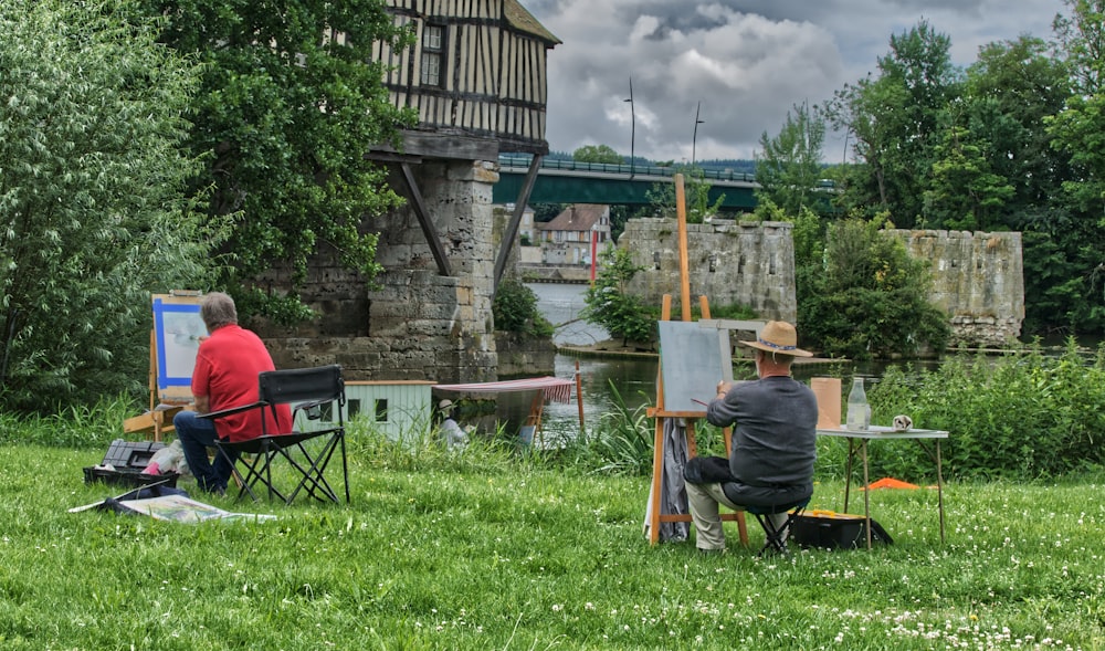 man in red shirt sitting on chair