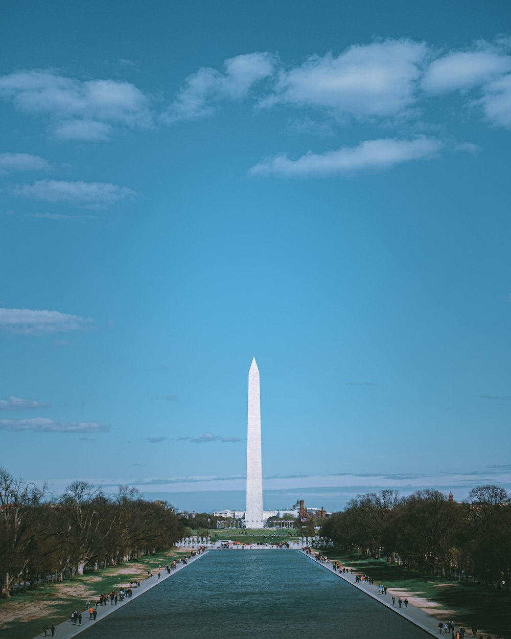 white concrete tower under blue sky during daytime