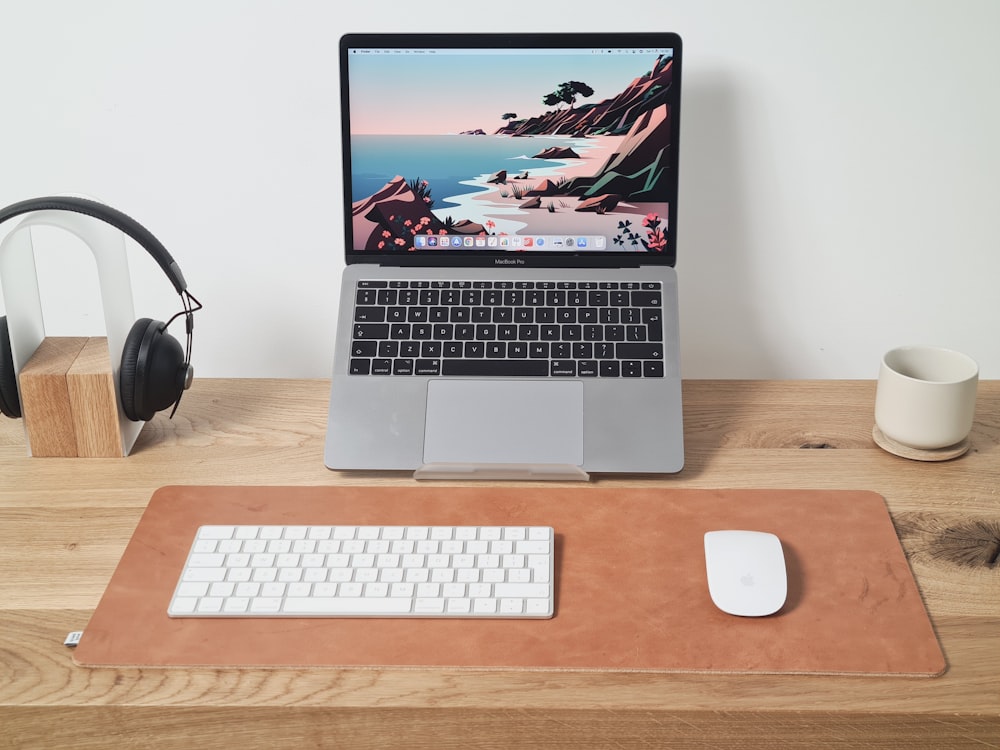 macbook pro beside apple magic mouse and apple magic mouse