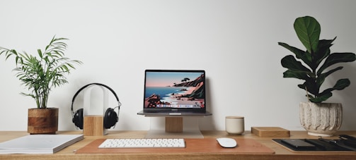 silver imac on brown wooden desk