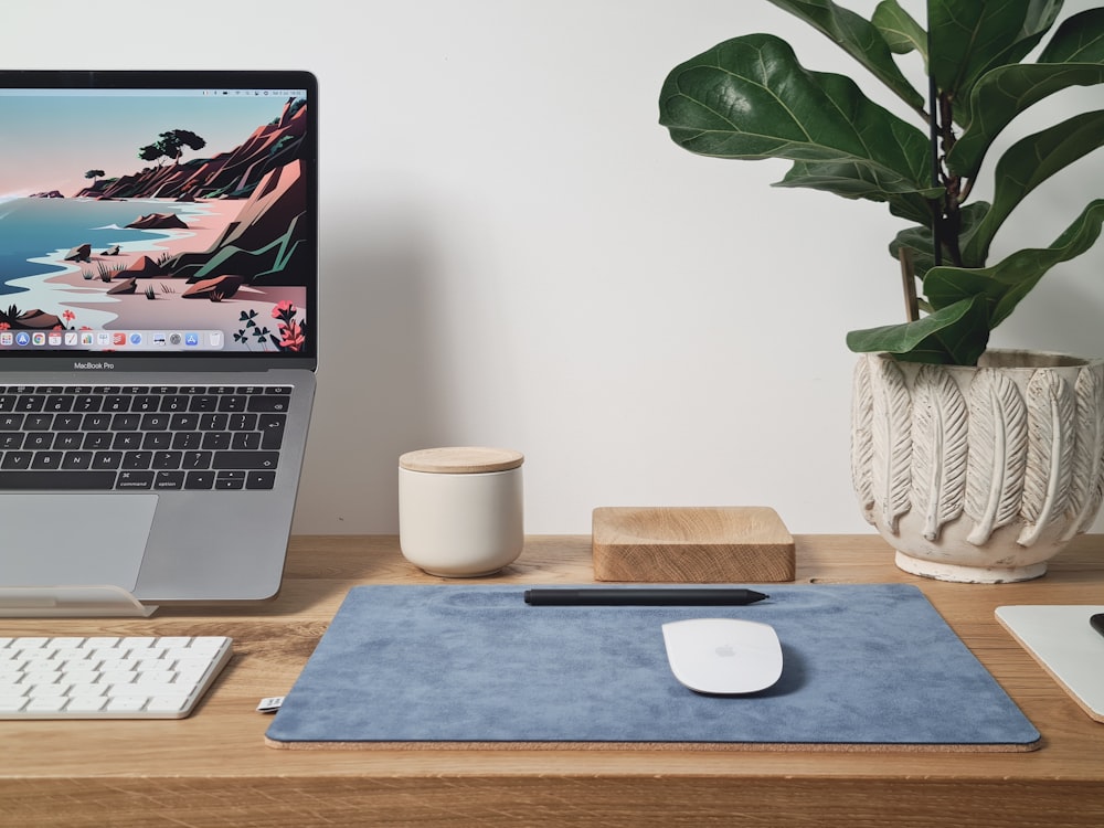 macbook pro on brown wooden table