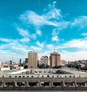 white and brown concrete building under blue sky during daytime