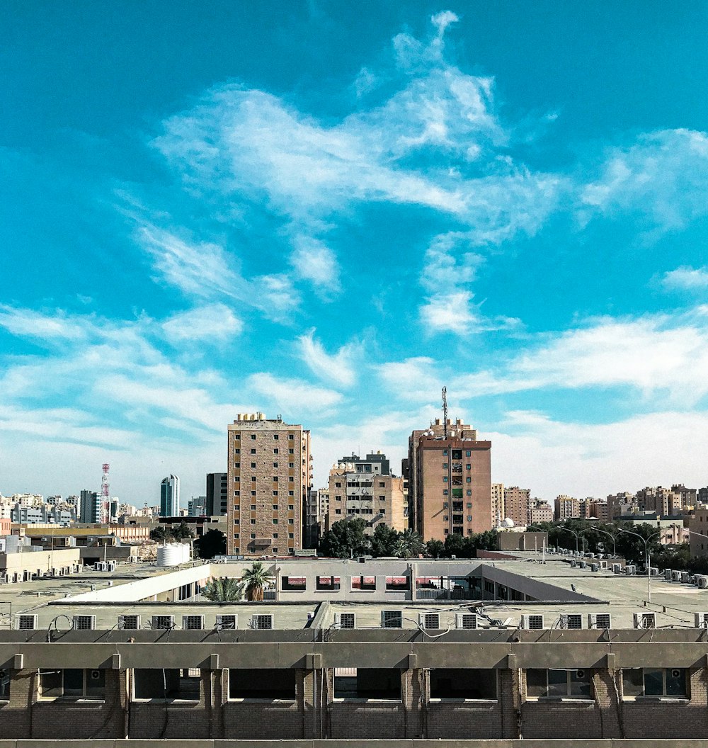 white and brown concrete building under blue sky during daytime