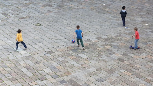 Children with mobility challenges playing together outdoors