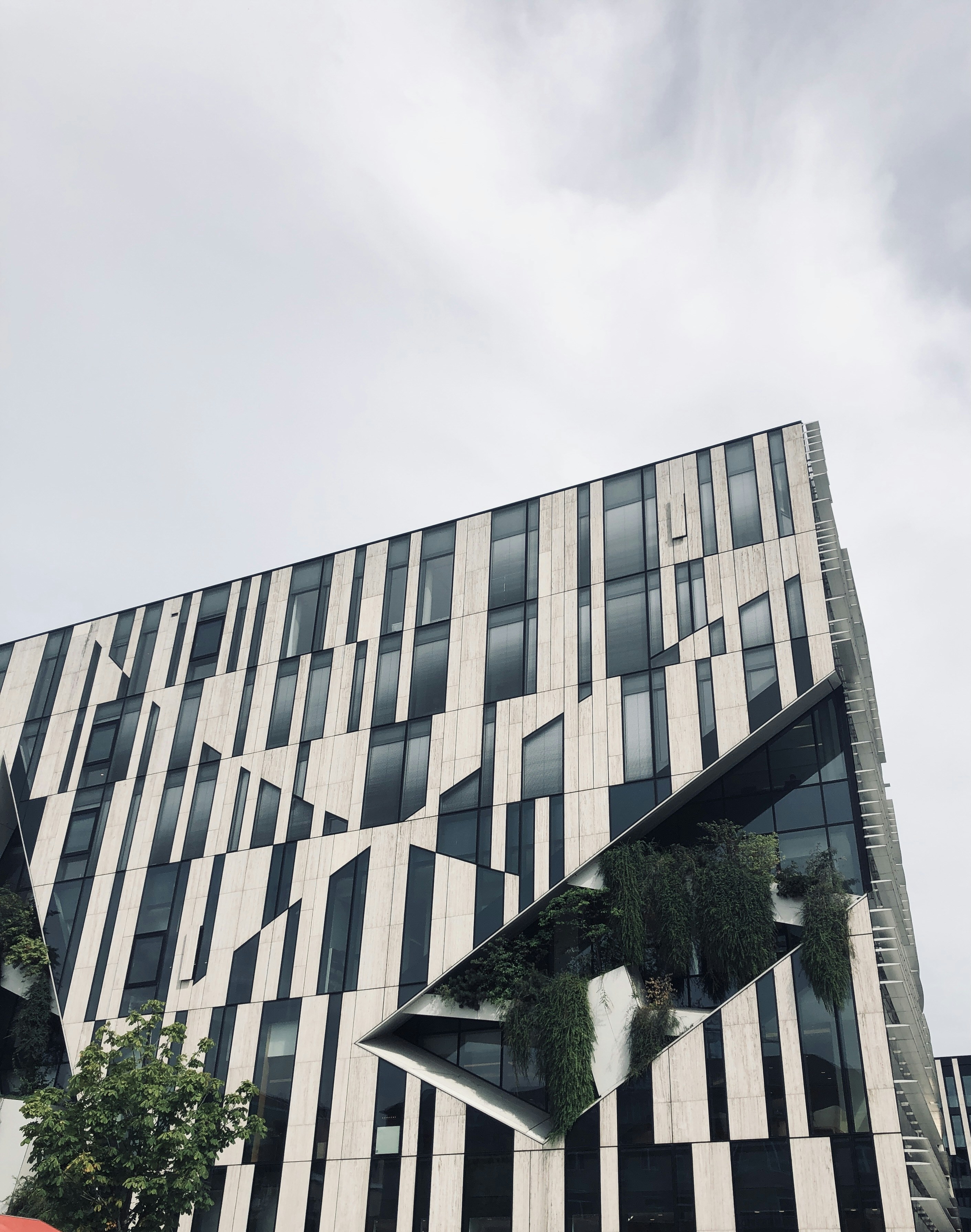 Stunning modern architectural building with geometric facade and glass elements