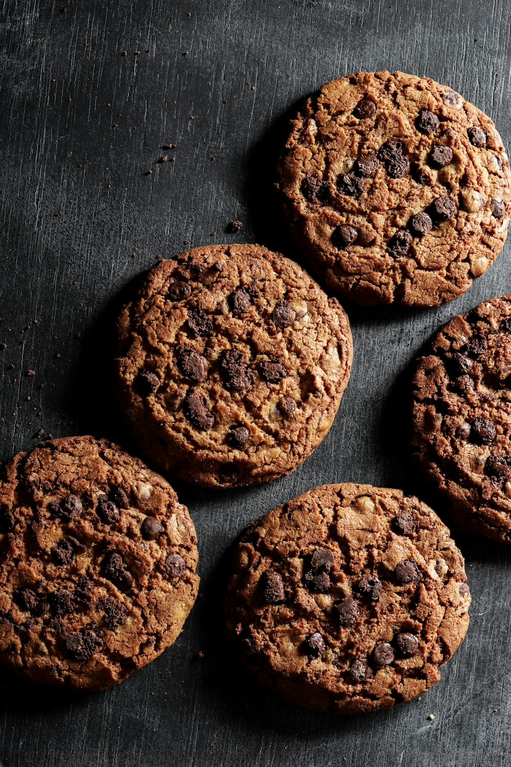 brown cookies on black surface